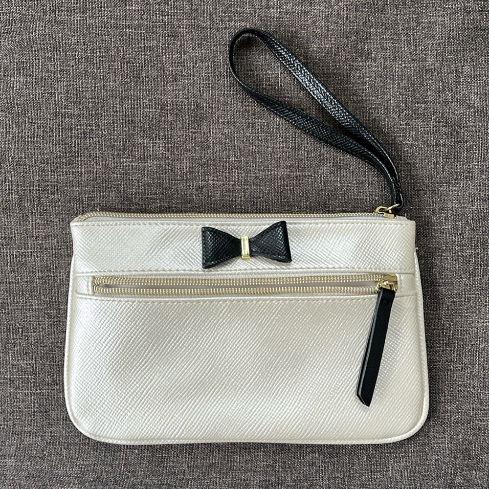 Cream wristlet with Black Bow